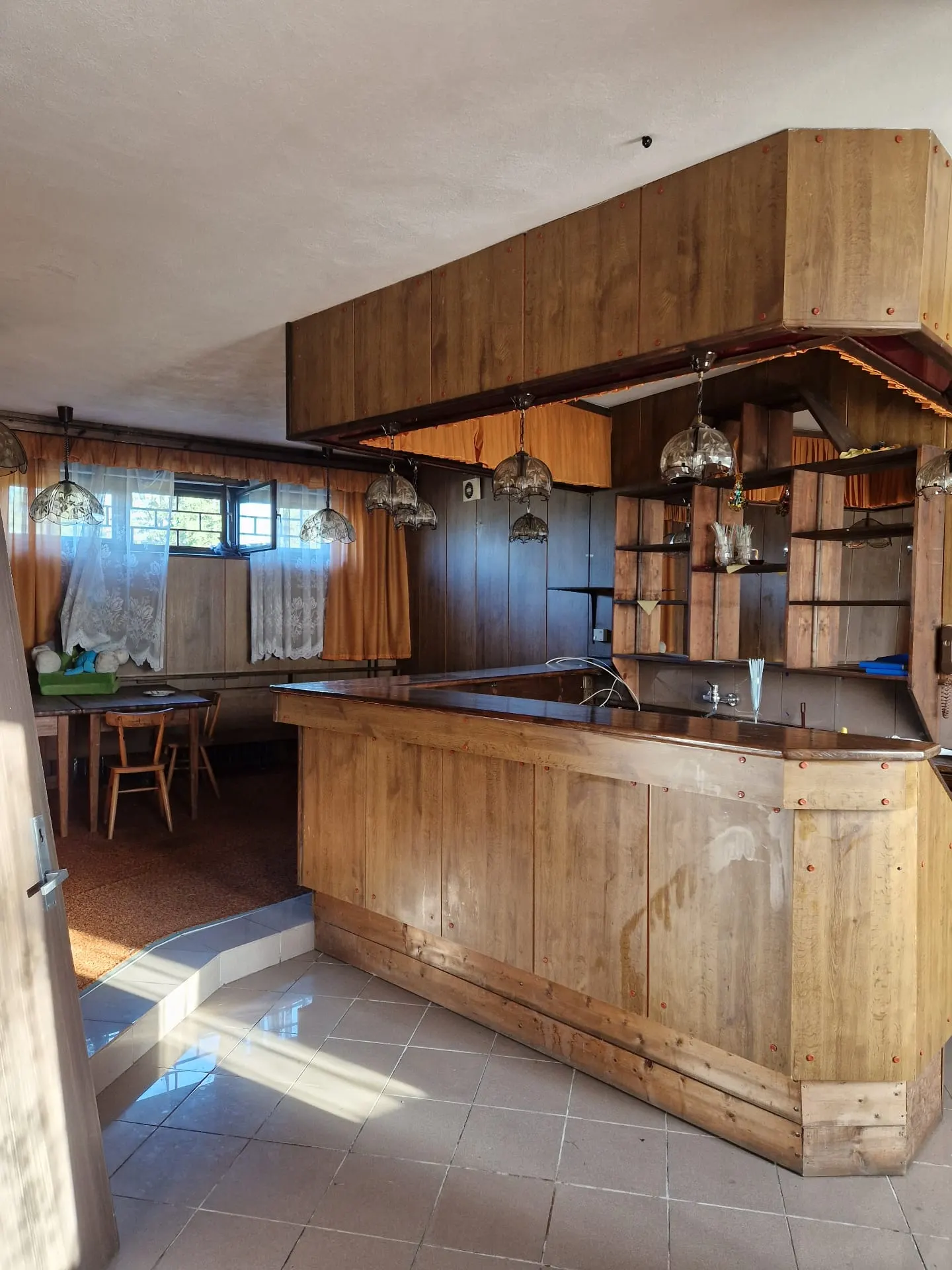 Lounge / bar area — before / after — After