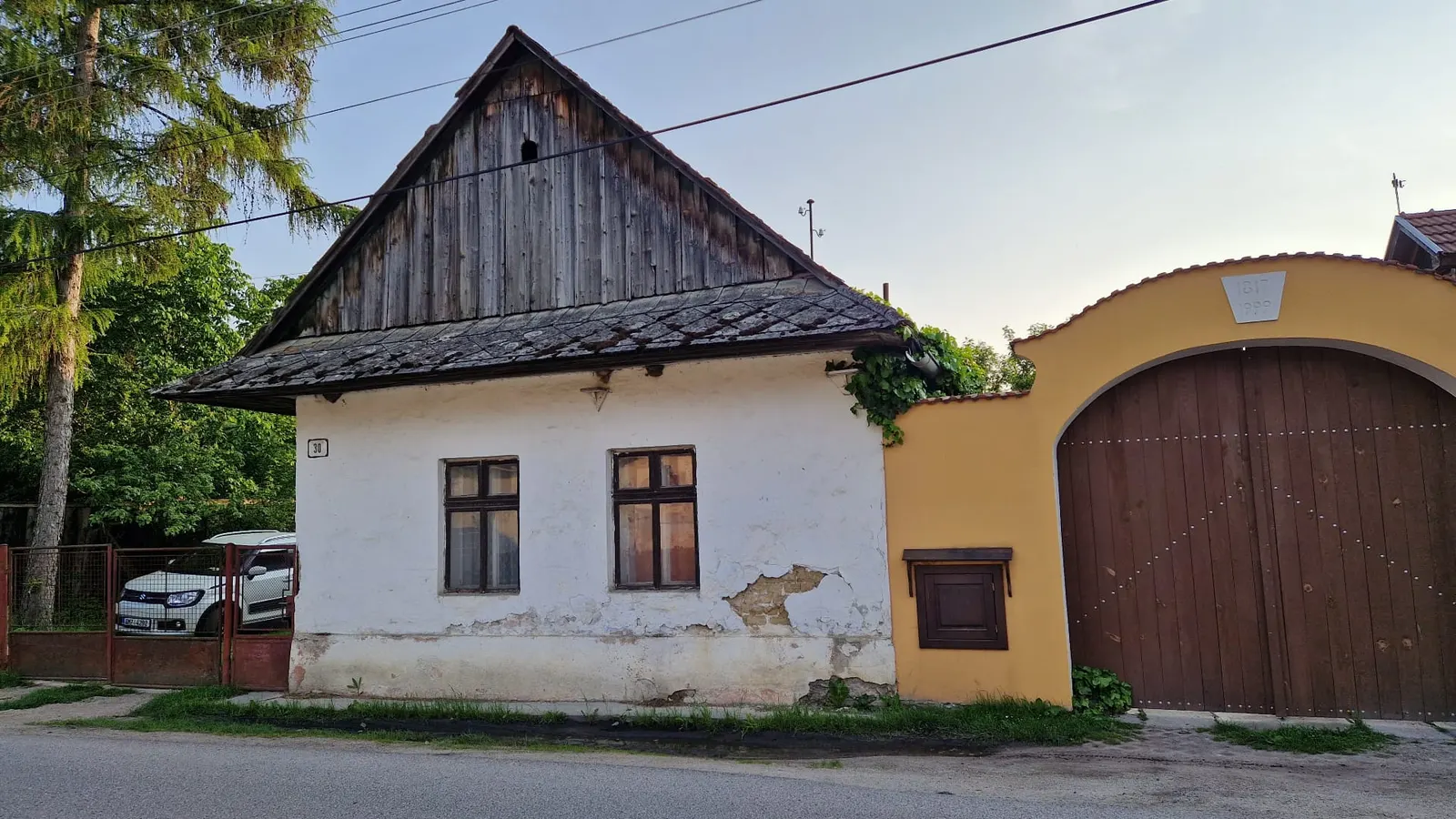 Front facade from the street — before / after — After