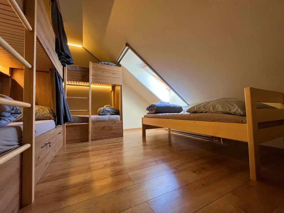 Sherpa's Hostel — attic room with beds under a skylight.