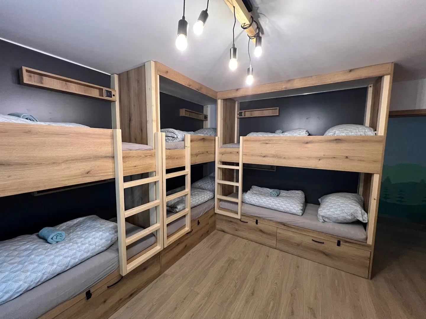 Hikers Paradise — wooden bunk beds in a dorm room.