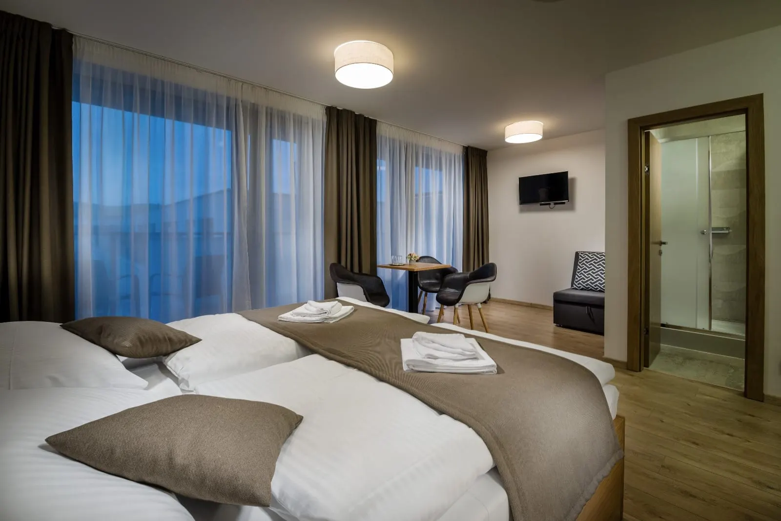Apartment bedroom — calm atmosphere, quality textiles and design elements.