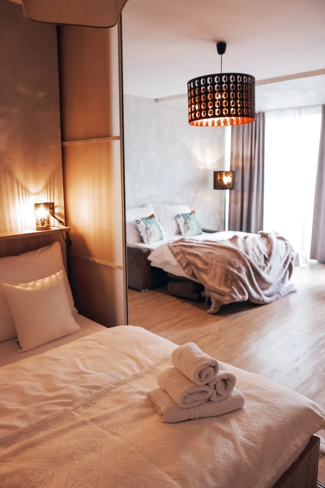 Sample apartment — bedroom area, seating and en-suite bathroom, equipment suited to wellness stays.